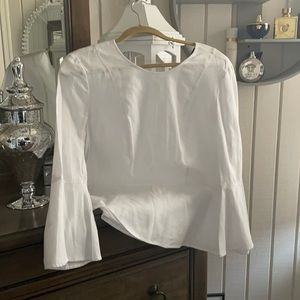 Brand new BCBG Maxazria white peplum top! Gorgeous